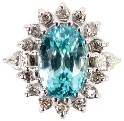 Lot 206 - A 14K WHITE GOLD BLUE TOPAZ AND DIAMOND DRESS...