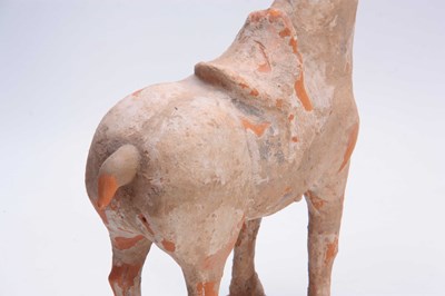 Lot 150 - A TANG DYNASTY PAINTED POTTERY HORSE (618 -...