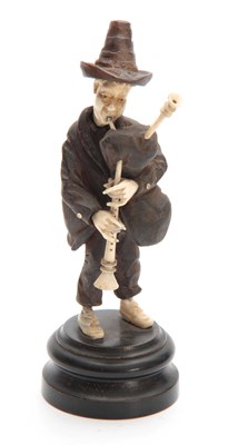 Lot 357 - A BLACK FOREST BONE AND CARVED WOOD STANDING...