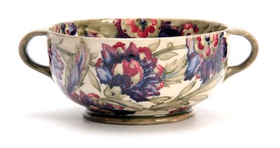 Lot 38 - A WILLIAM MOORCROFT BURSLEM FOOTED TWO-HANDLED...