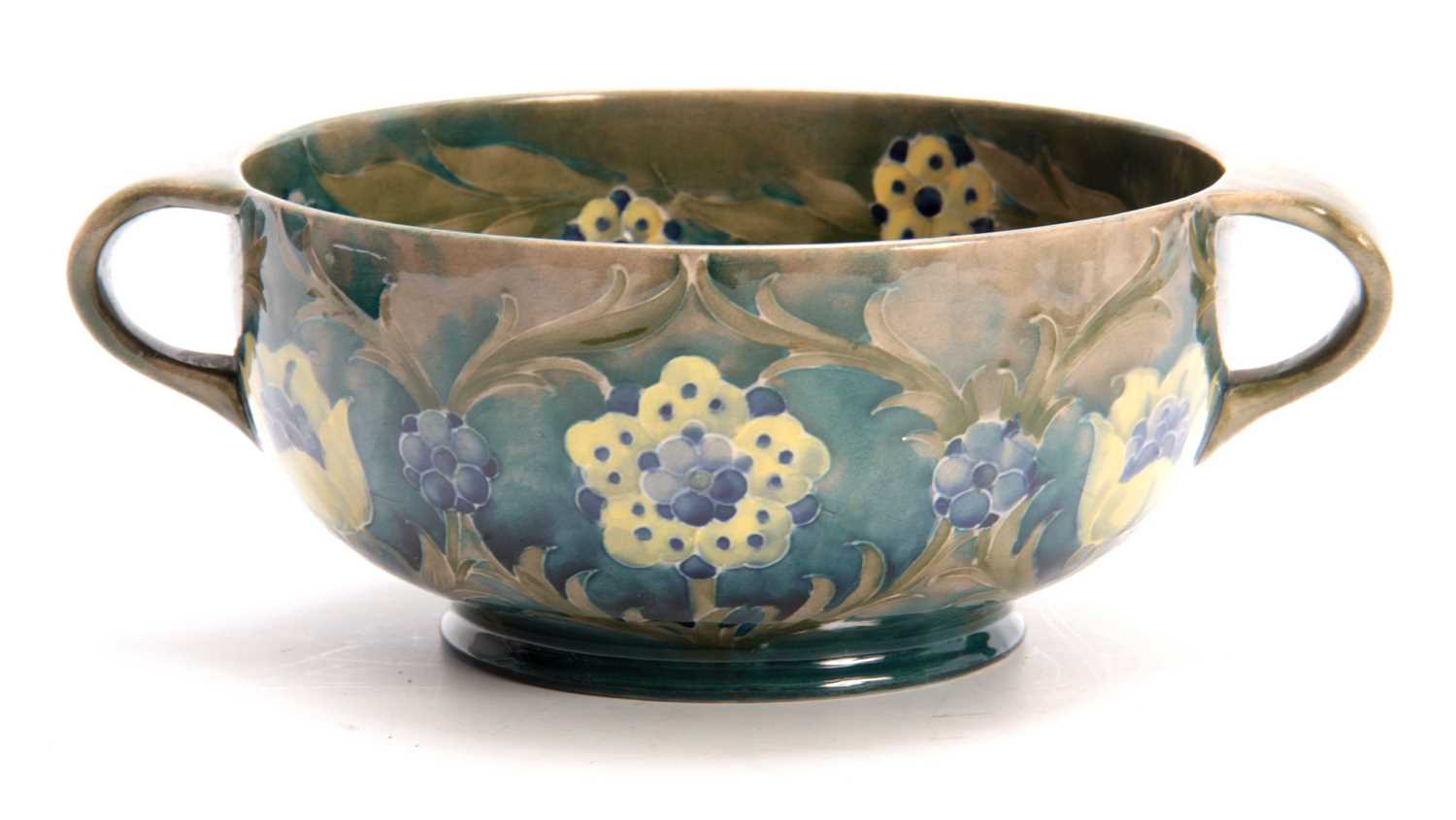 Lot 39 - A WILLIAM MOORCROFT BURSLEM FOOTED TWO-HANDLED...