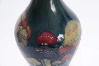 Lot 52 - A MOORCROFT CLAREMONT BALUSTER VASE the body...