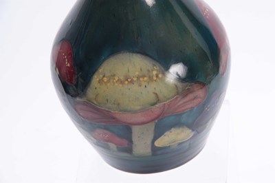 Lot 52 - A MOORCROFT CLAREMONT BALUSTER VASE the body...