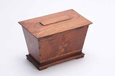 Lot 953 - AN ARTS AND CRAFT INLAID OAK TEA CADDY of...