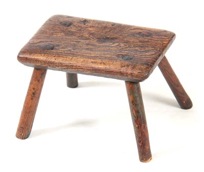 Lot 1122 - AN 18TH CENTURY OAK MILKING STOOL with...