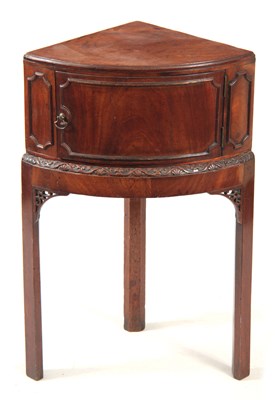 Lot 1141 - A GEORGE III MAHOGANY CORNER BEDSIDE TABLE...