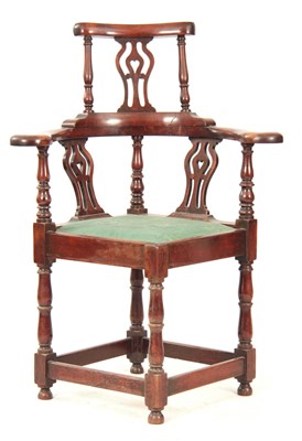 Lot 1170 - A GEORGE II WALNUT CORNER CHAIR with shaped...