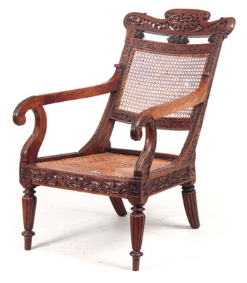 Lot 1190 - AN ANGLO INDIAN ROSEWOOD BERGERE ARMCHAIR...