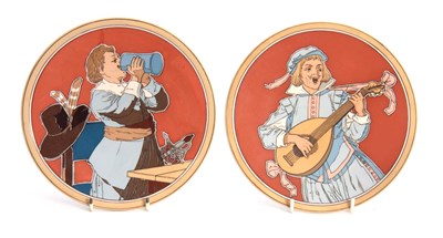 Lot 123 - A PAIR OF METTLACH HANGING PLAQUES depicting a...