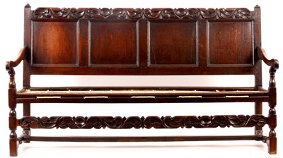 Lot 1221 - A CHARLES II JOINED OAK SETTLE with quadruple...