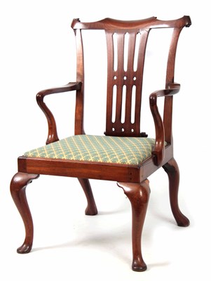 Lot 1245 - AN EARLY GEORGE III FIGURED MAHOGANY ARMCHAIR...