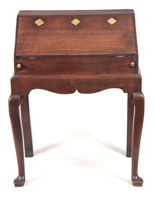 Lot 1297 - AN 18TH CENTURY OAK BUREAU ON STAND with...