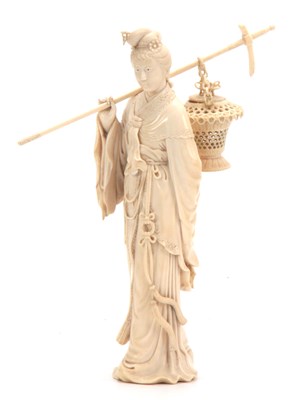 Lot 193 - A 19TH CENTURY CHINESE CARVED IVORY FIGURE OF...