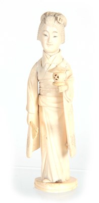 Lot 202 - A JAPANESE MEIJI PERIOD IVORY OKIMONO modelled...