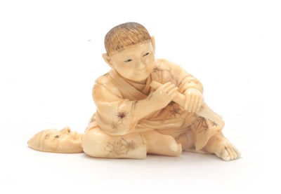 Lot 206 - A JAPANESE CARVED IVORY OKIMONO modelled as a...