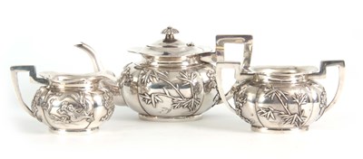 Lot 224 - A 19TH CENTURY CHINESE THREE-PIECE SILVER TEA...