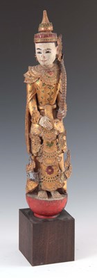 Lot 272 - A CARVED STATUE OF A WOODEN BUDDHA mounted on...