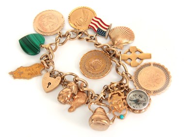 Lot 311 - A 9CT GOLD CHARM BRACELET with thirteen 9ct...