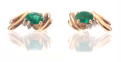 Lot 316 - A PAIR OF LADIES 14CT GOLD EMERALD AND DIAMOND...