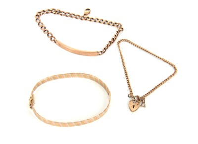 Lot 332 - THREE 9CT GOLD BRACELETS to include a...