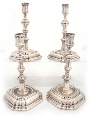 Lot 382 - A SET OF FOUR CONTINENTAL CAST SILVER CANDLE...