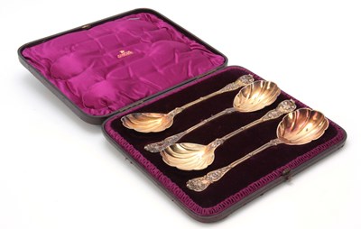 Lot 398 - A SET OF FOUR CASED SILVER GILT SERVING SPOONS...
