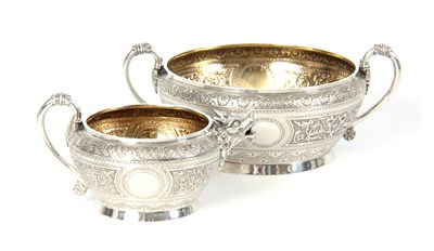 Lot 401 - A VICTORIAN SILVER AND GILT CREAM JUG AND...
