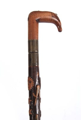 Lot 444 - A LATE 19th CENTURY SWORD STICK the fruitwood...