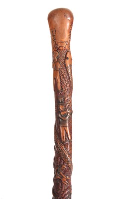 Lot 446 - A 19th CENTURY CARVED FRUITWOOD WALKING CANE...