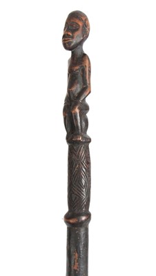Lot 449 - AN AFRICAN CARVED EBONISED WALKING CANE the...