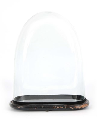 Lot 515 - A 19TH CENTURY GLASS DOME mounted on an...