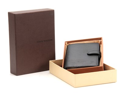 Lot 518 - A LOUIS VUITTON GRAINED BLACK LEATHER FOLDING...