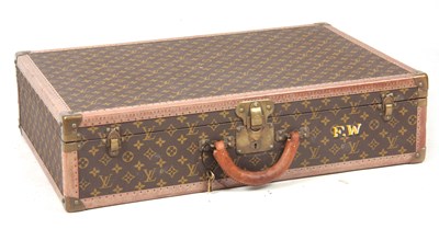 Lot 520 - A VINTAGE LOUIS VUITTON BROWN LEATHER SUITCASE...