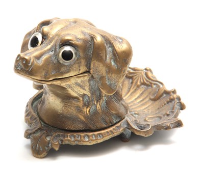 Lot 594 - A HEAVY ORNATE CAST BRASS DOGS HEAD INK STAND...