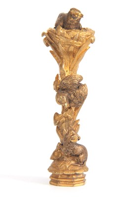 Lot 670 - A 19th CENTURY ORMOLU SEAL modelled as two...