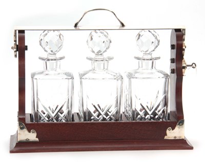 Lot 705 - A 20TH CENTURY MAHOGANY TANTULAS having a...