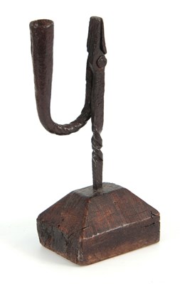 Lot 736 - AN EARLY 18th CENTURY RUSHLIGHT ON OAK BLOCK...