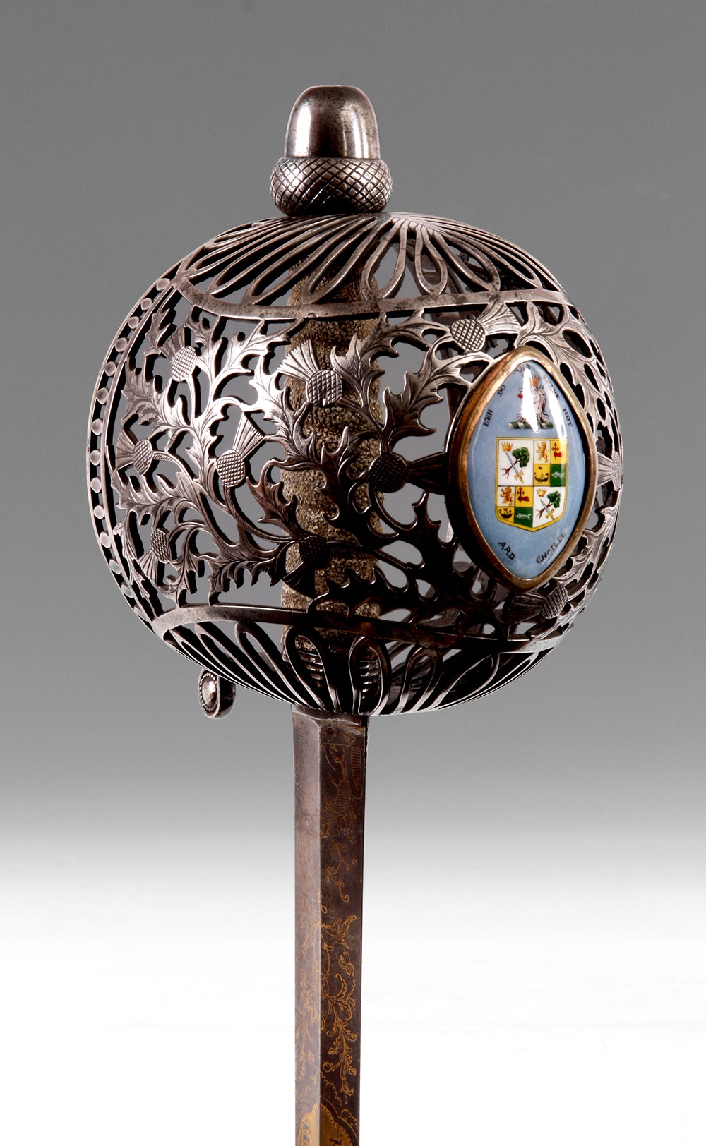 Rare late eighteenth-century Scottish sword with pierced basket hilt and armorial plaque