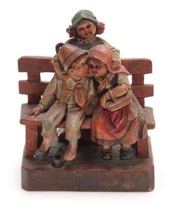 Lot 877 - A CONTINENTAL CARVED POLYCHROME FIGURE of...