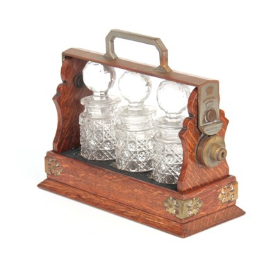 Lot 924 - A 19TH CENTURY MINIATURE OAK TANTALUS stamped...