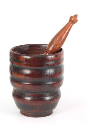 Lot 936 - AN 18TH CENTURY YEW-WOOD PESTLE AND MORTAR of...
