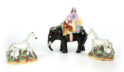 Lot 95 - A 19TH CENTURY STAFFORDSHIRE FIGURE OF AN...