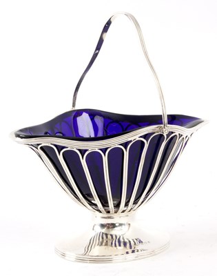 Lot 294 - AN EDWARD VII BOAT-SHAPED SILVER SUGAR BASKET...