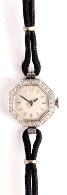 Lot 229 - AN LADIES OCTAGNAL SWISS DIAMOND ENCRUSTED...