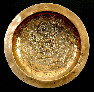 Lot 404 - A 17TH CENTURY CONTINENTAL BRASS ALMS DISH...