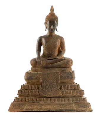 Lot 153 - AN EARLY TIBETAN CAST BRONZE SEATED BUDDHA...