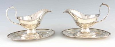 Lot 1264 - A LARGE PAIR OF 19TH CENTURY SILVER PLATED SAUCE BOATS ON FIXED STANDS