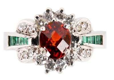 Lot 204 - A 14K WHITE GOLD OVAL CLUSTER HEAD RING the...