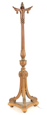 Lot 1046 - A CARVED GILTWOOD STANDARD LAMP IN THE MANNER...
