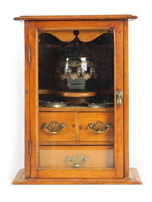Lot 1016 - A STYLISH EDWARDIAN OAK SMOKERS CABINET with...